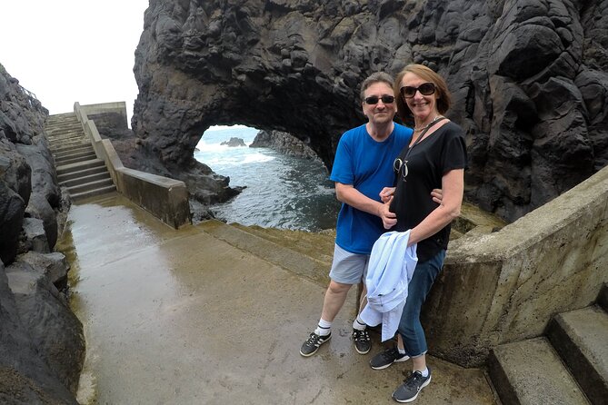 Natural Pools and Waterfalls Private Tour - Praia do Seixal: black sand, a small waterfall, and a swim option